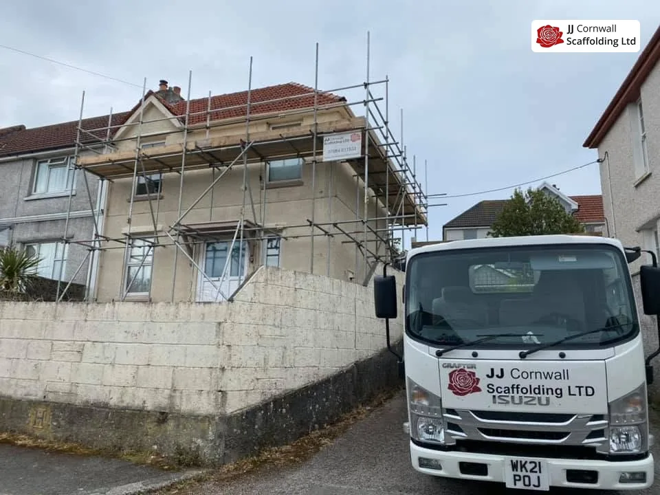 JJ Cornwall Scaffolding: white branded isuzu tipper at a domestic scaffold job