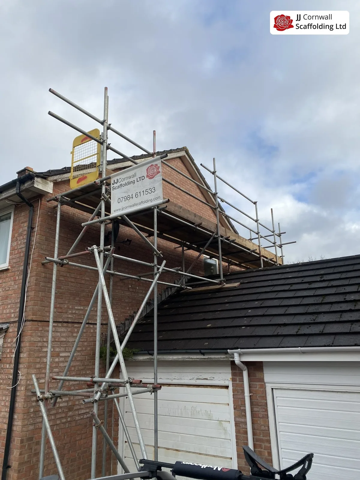 Chimney scaffolding in Cornwall: brick chimney stack access over a tiled roof