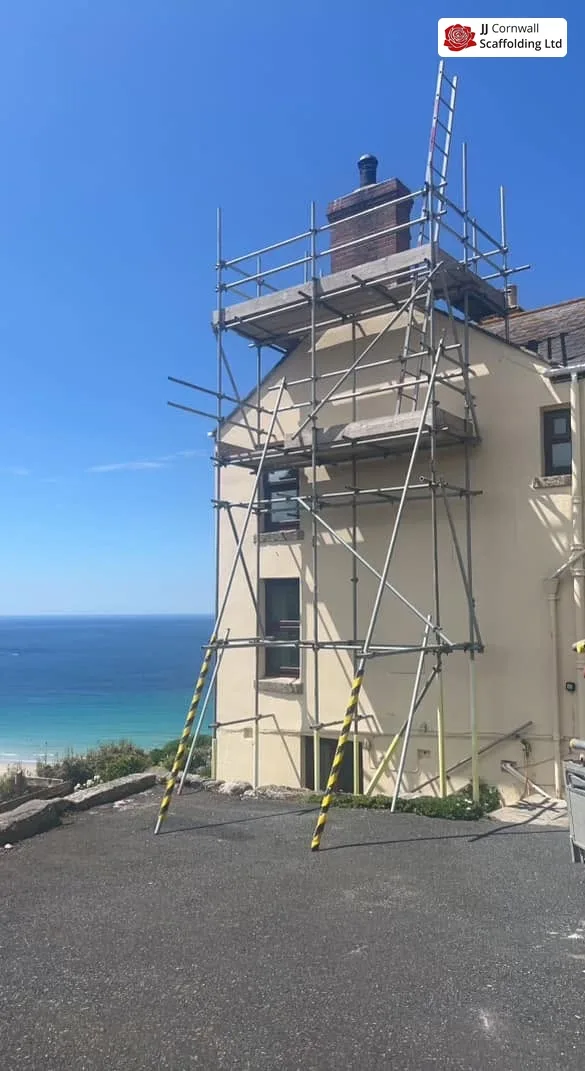 Scaffold erected on a coastal property at Porthleven