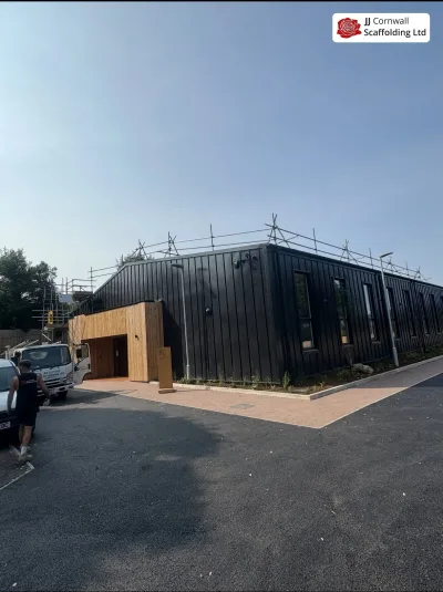 Scaffolding adapted lift by lift on a new build in Cornwall