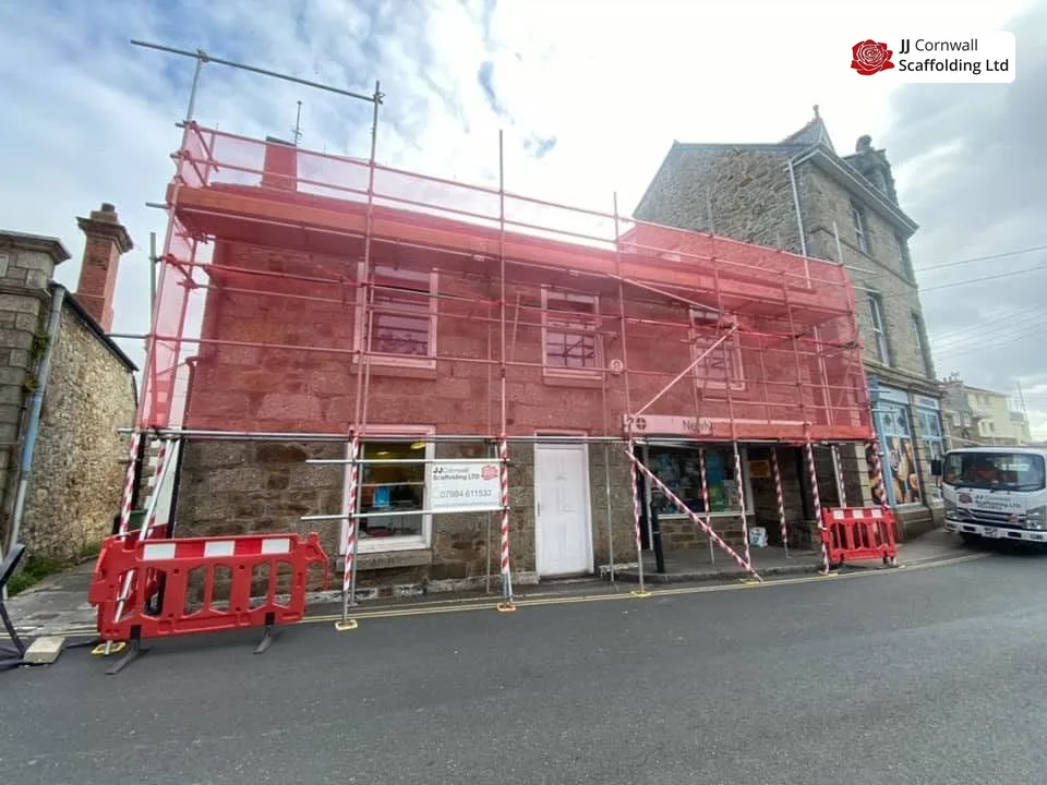 Scaffold with pedestrian gantry on a Camborne town-centre frontage