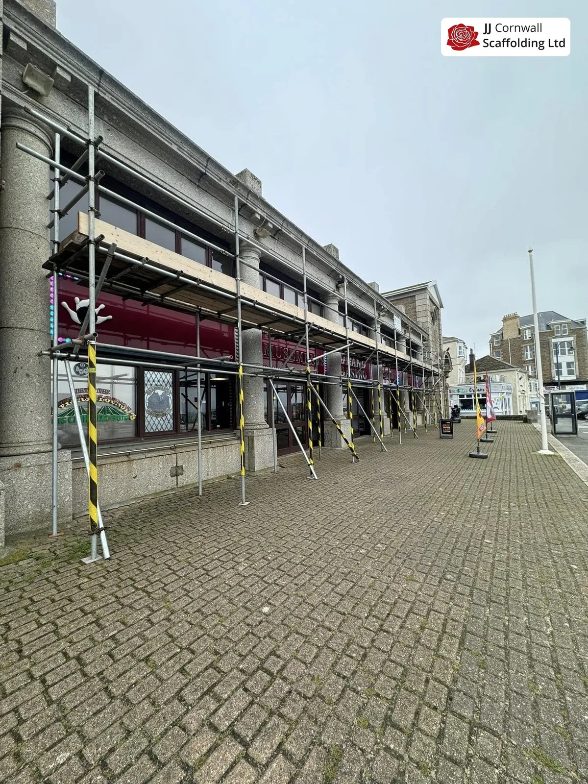 Commercial scaffold with pedestrian gantry over a Redruth shopfront