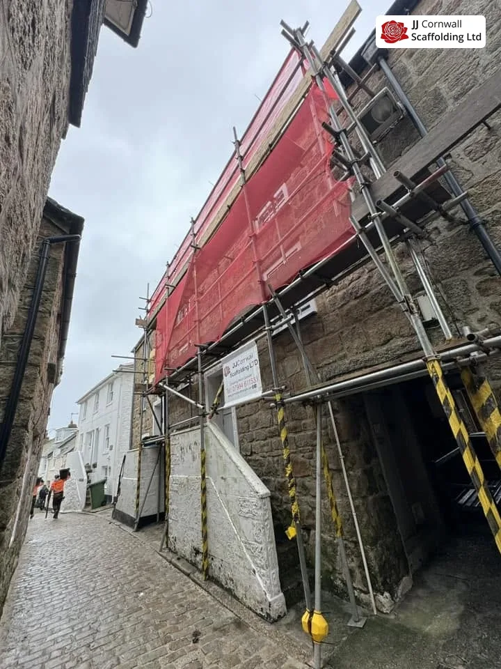 Scaffold erected in a narrow conservation-area street in Marazion