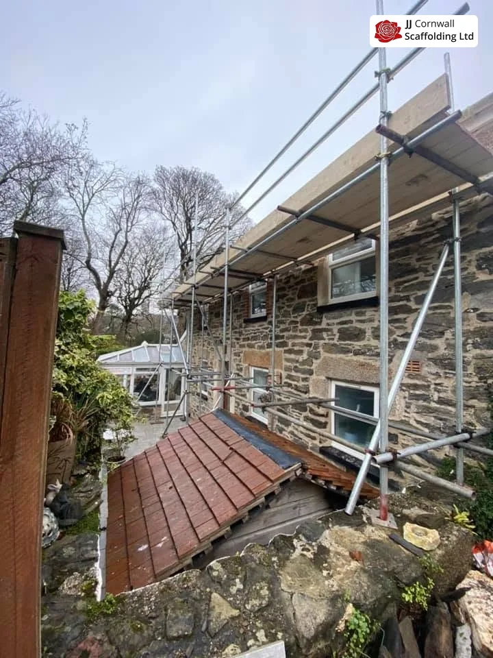Scaffold base stepped and levelled on a sloping St Agnes street