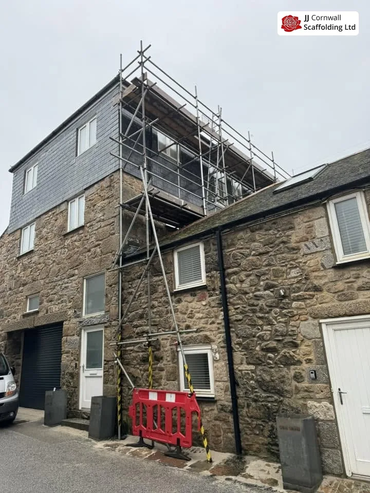 Scaffold tied to a slate-hung elevation in Penryn