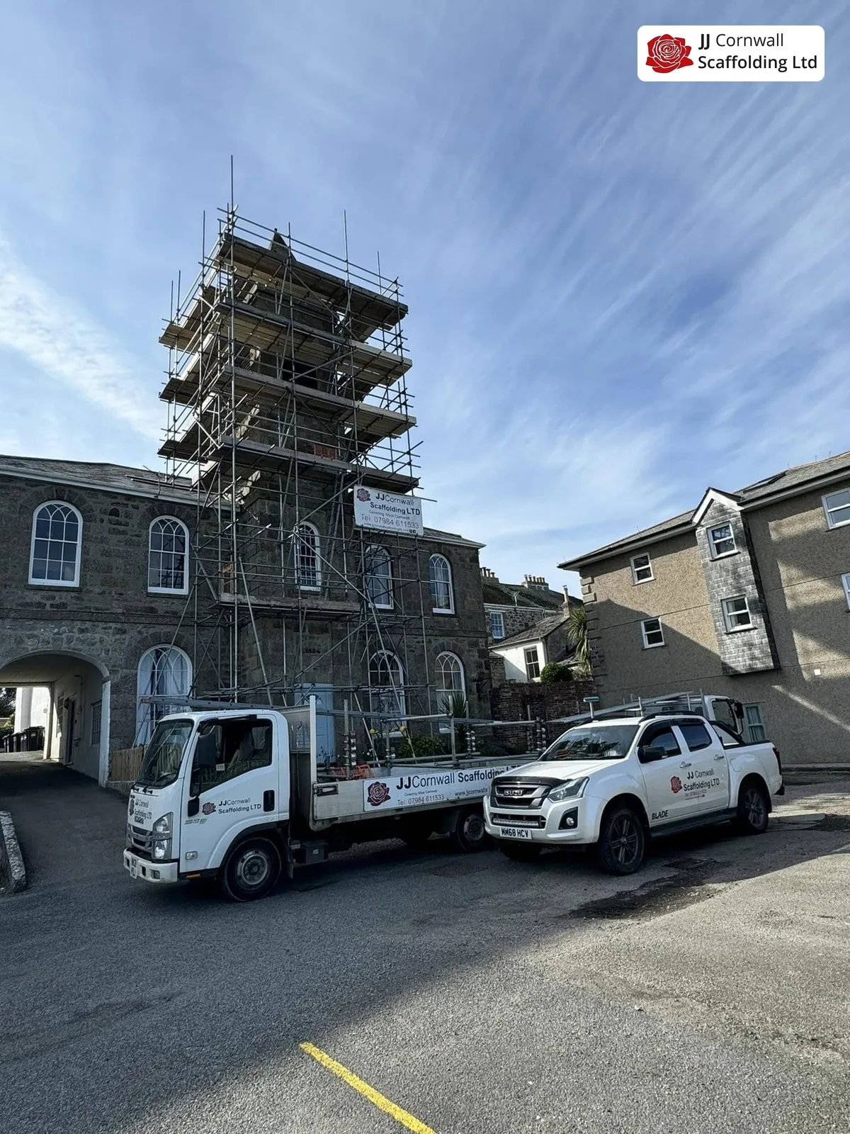 Heritage scaffolding in Cornwall: chapel tower scaffold with branded truck and pickup