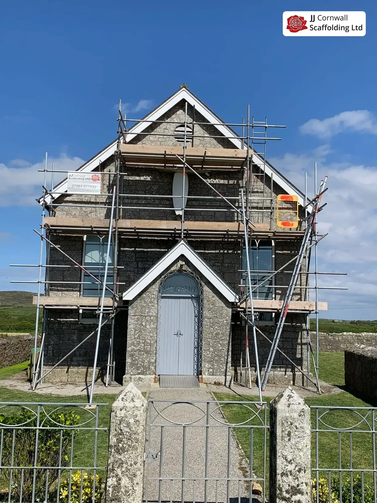 Heritage scaffolding in Cornwall: listed granite chapel gable scaffold both elevations from the gate