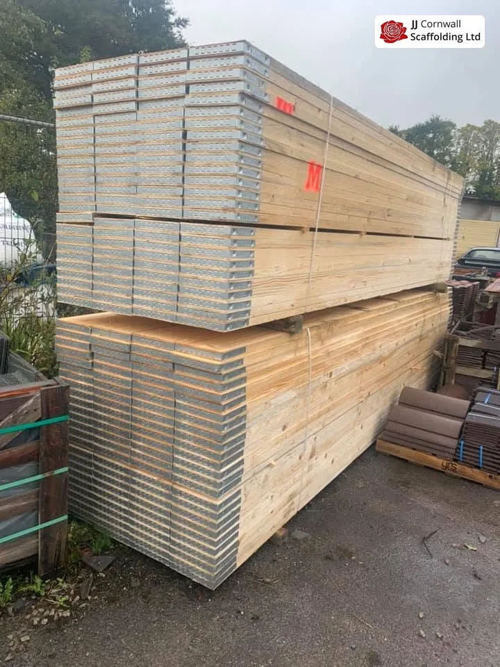Scaffold hire in Cornwall: new scaffold boards and steel decks stacked in the yard