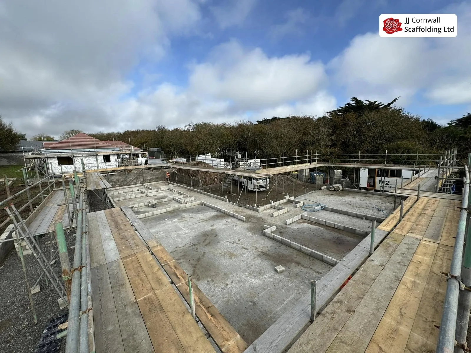 Scaffold hire in Cornwall: wide boarded deck over an excavated foundation
