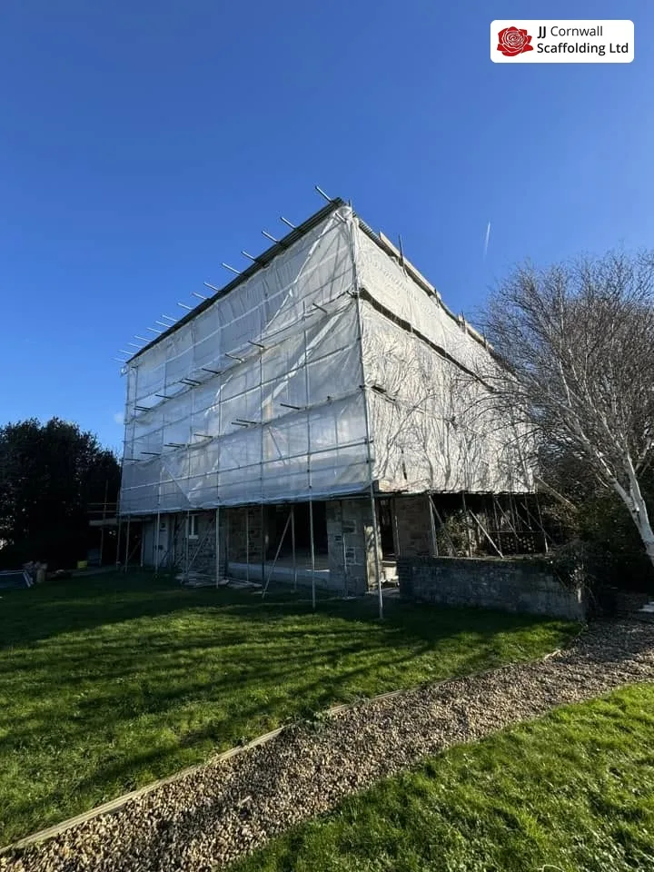 Temporary roof scaffolding on an exposed property near the Lizard