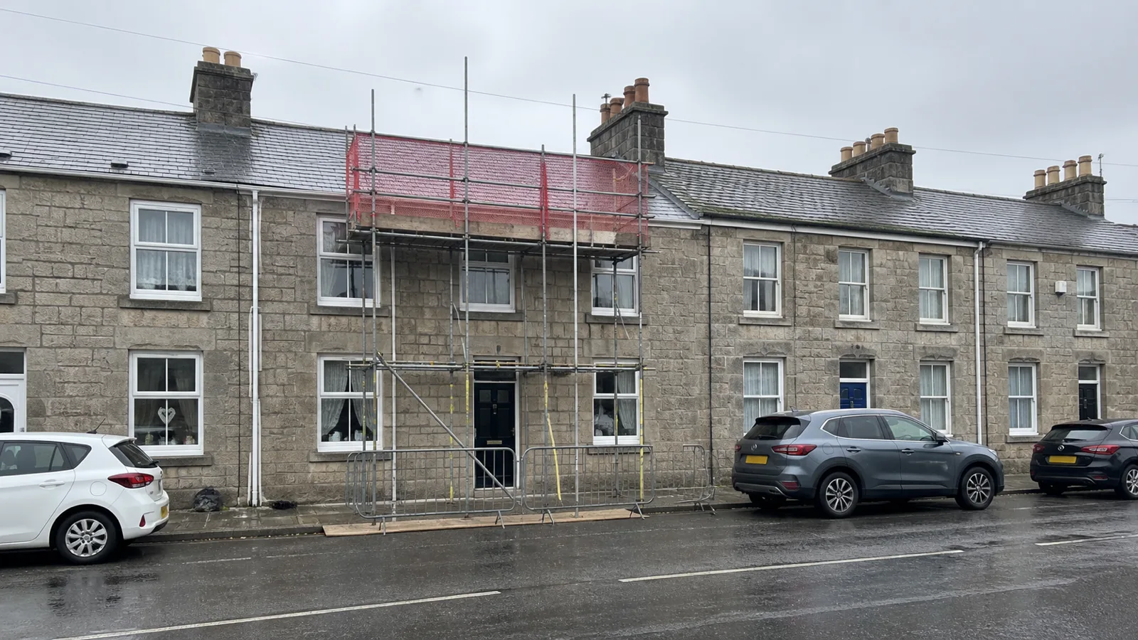 Scaffolding erected on a terraced house in Camborne