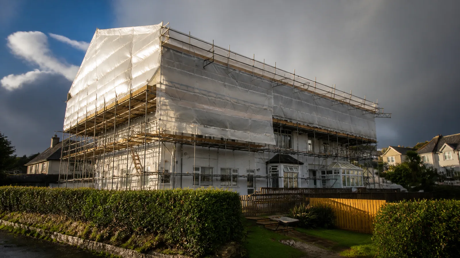 Temporary roof scaffolding covering a Cornish property during a re-roof